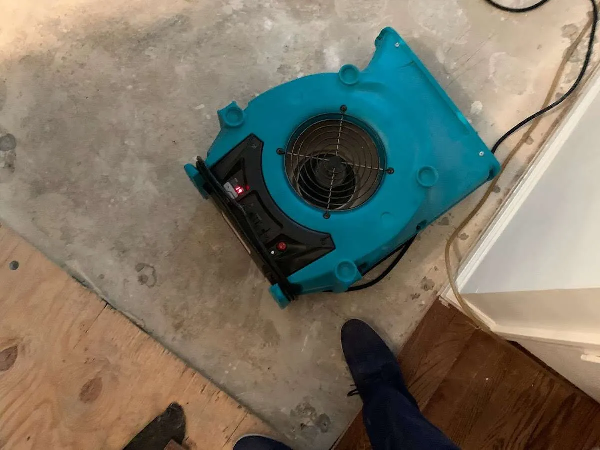 Air mover drying subfloor during Leak Detection & Repair in Rio Rico